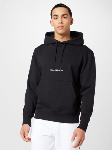 Sweat-shirt Calvin Klein Jeans en noir : devant