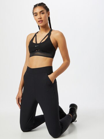 NIKE Tapered Sportbroek 'Bliss Luxe' in Zwart