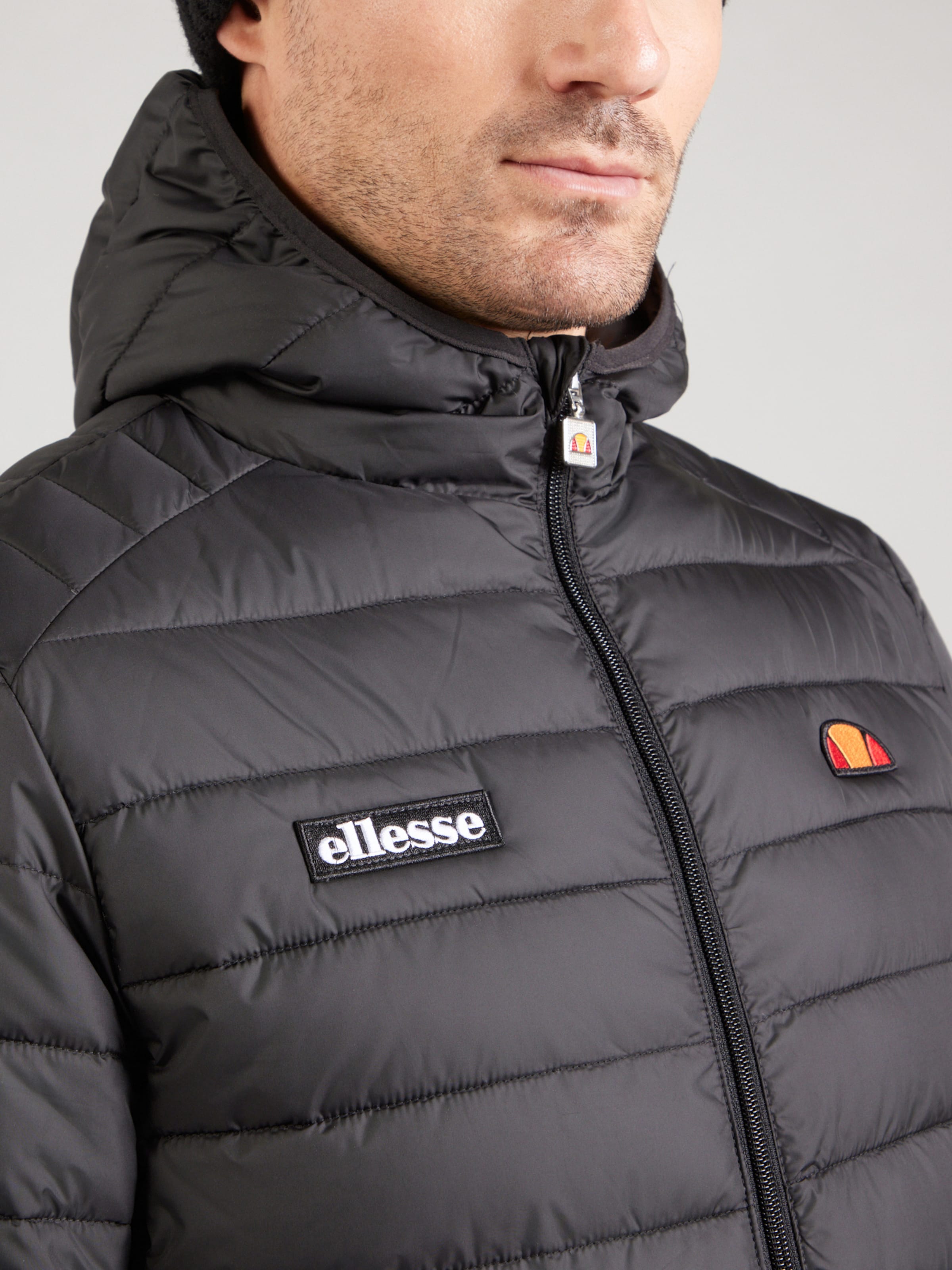 ELLESSE Between-Season Jacket 'Lombardy' in Black | ABOUT YOU
