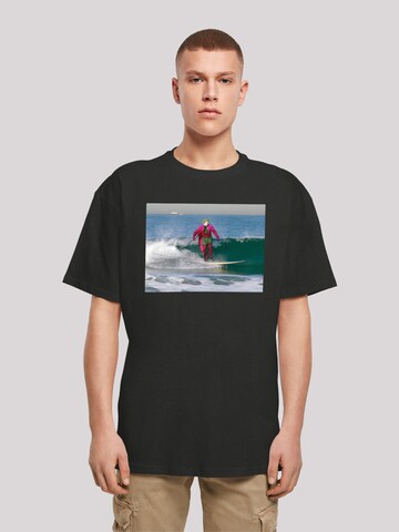 F4NT4STIC Shirt 'Batman TV Series Joker Surfing' in Zwart: voorkant
