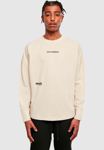 Merchcode Shirt 'Apoh - Stay Surreal Slogan' in Beige: Vorderseite