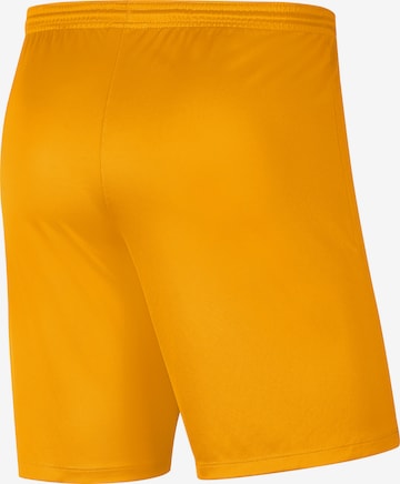 NIKE Regular Workout Pants in Yellow