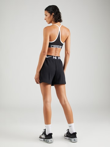 Nike Sportswear Ohlapna forma Hlače | črna barva