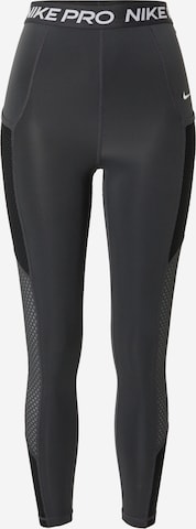 Skinny Pantaloni sport de la NIKE pe gri: față