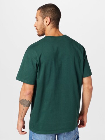 Carhartt WIP T-shirt 'Chase' i grön