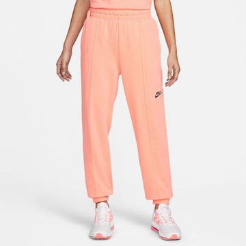 Nike Sportswear Tapered Pants in Orange: front