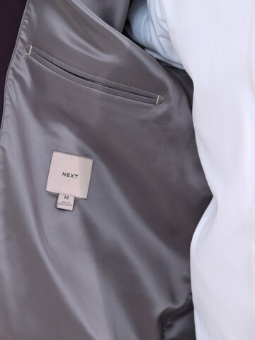Next - Chaqueta de entretiempo 'Motionflex' en rojo
