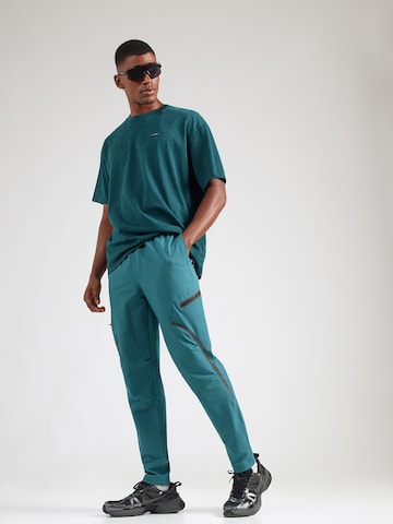 UNDER ARMOUR - regular Pantalón deportivo 'Unstoppable' en verde