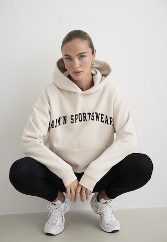 Sweat de sport Aim'n en beige : devant
