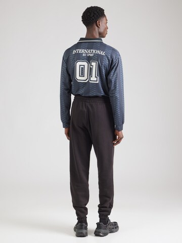 NEW ERA Конический (Tapered) Штаны 'NEYYAN' в Черный