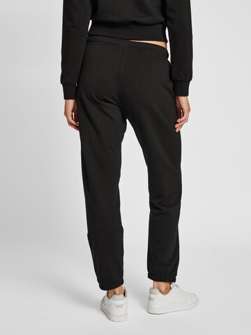 Effilé Pantalon de sport Hummel en noir