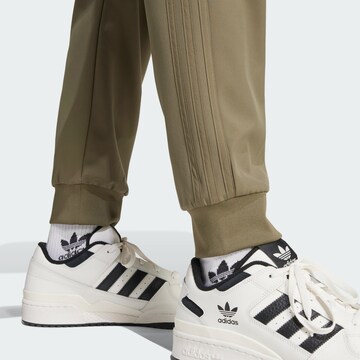 ADIDAS ORIGINALS Tapered Trousers in Green