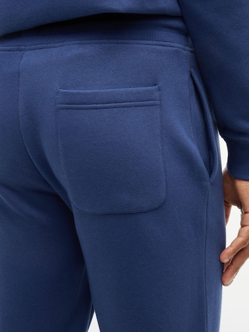 Tommy Jeans Tapered Hose in Blau