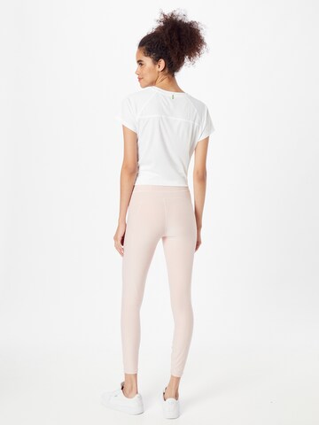 Skinny Pantaloni sport de la PUMA pe roz