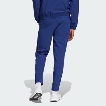 ADIDAS SPORTSWEAR Конический (Tapered) Спортивные штаны 'House of Tiro' в Синий