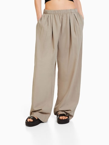 Bershka Wide leg Bandplooi jeans in Beige: voorkant