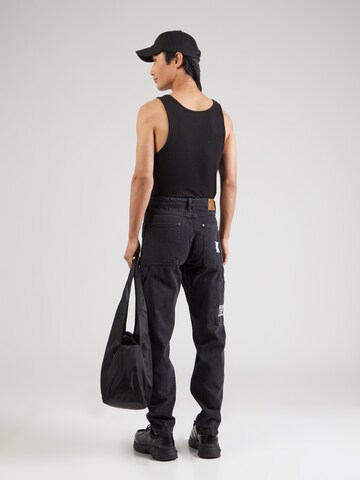 Karl Kani Tapered Jeans in Black