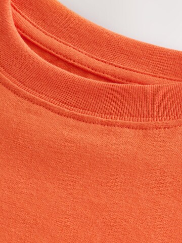 T-Shirt Next en orange
