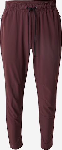 Pantalon de sport 'UNLIMITED' NIKE en rouge : devant