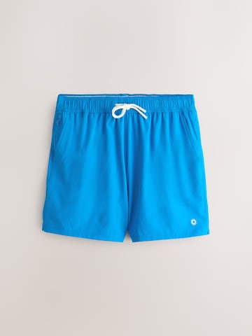 zils Next Peldšorti 'Essential Motion'