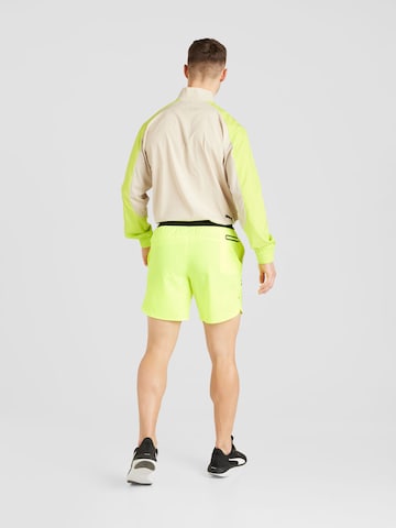 UNDER ARMOUR Regular Workout Pants 'Peak' in Yellow