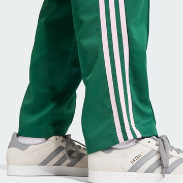 žalia ADIDAS ORIGINALS Laisvas Kelnės