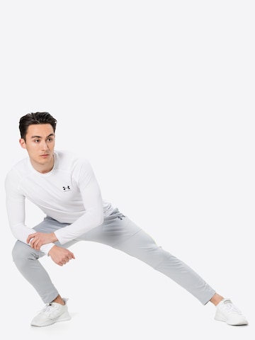 Tricou funcțional de la UNDER ARMOUR pe alb