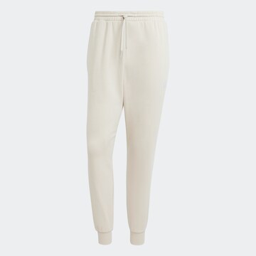 Tapered Pantaloni sportivi 'Feelcozy' di ADIDAS SPORTSWEAR in beige: frontale