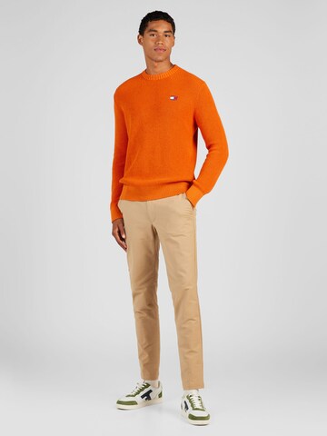 Tommy Jeans Pulover | oranžna barva