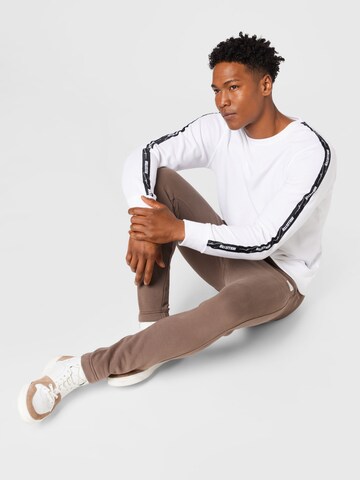 HOLLISTER Tapered Broek in Bruin