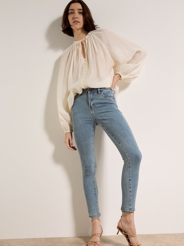 Skinny Jean Apricot en vert