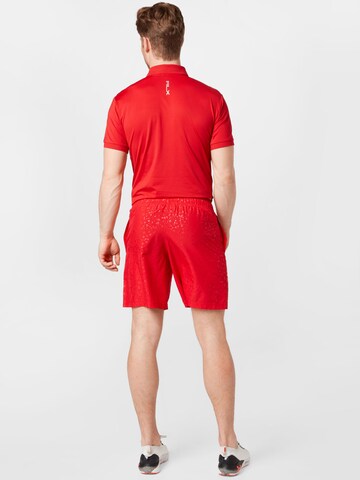 Regular Pantaloni sport de la UNDER ARMOUR pe roșu