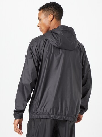 Veste de sport ADIDAS SPORTSWEAR en noir