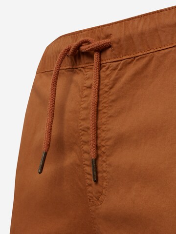 Tapered Pantaloni cargo di Urban Classics in marrone