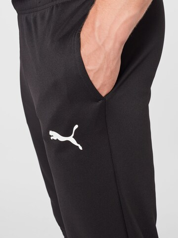 PUMATapered Sportske hlače 'TeamRise' - crna boja