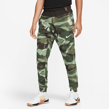 NIKE Tapered Workout Pants in Green: front