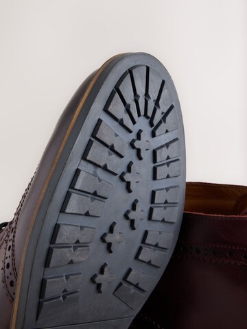 Boots stringati di Next in rosso