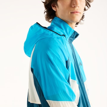 new balance - Chaqueta deportiva en azul