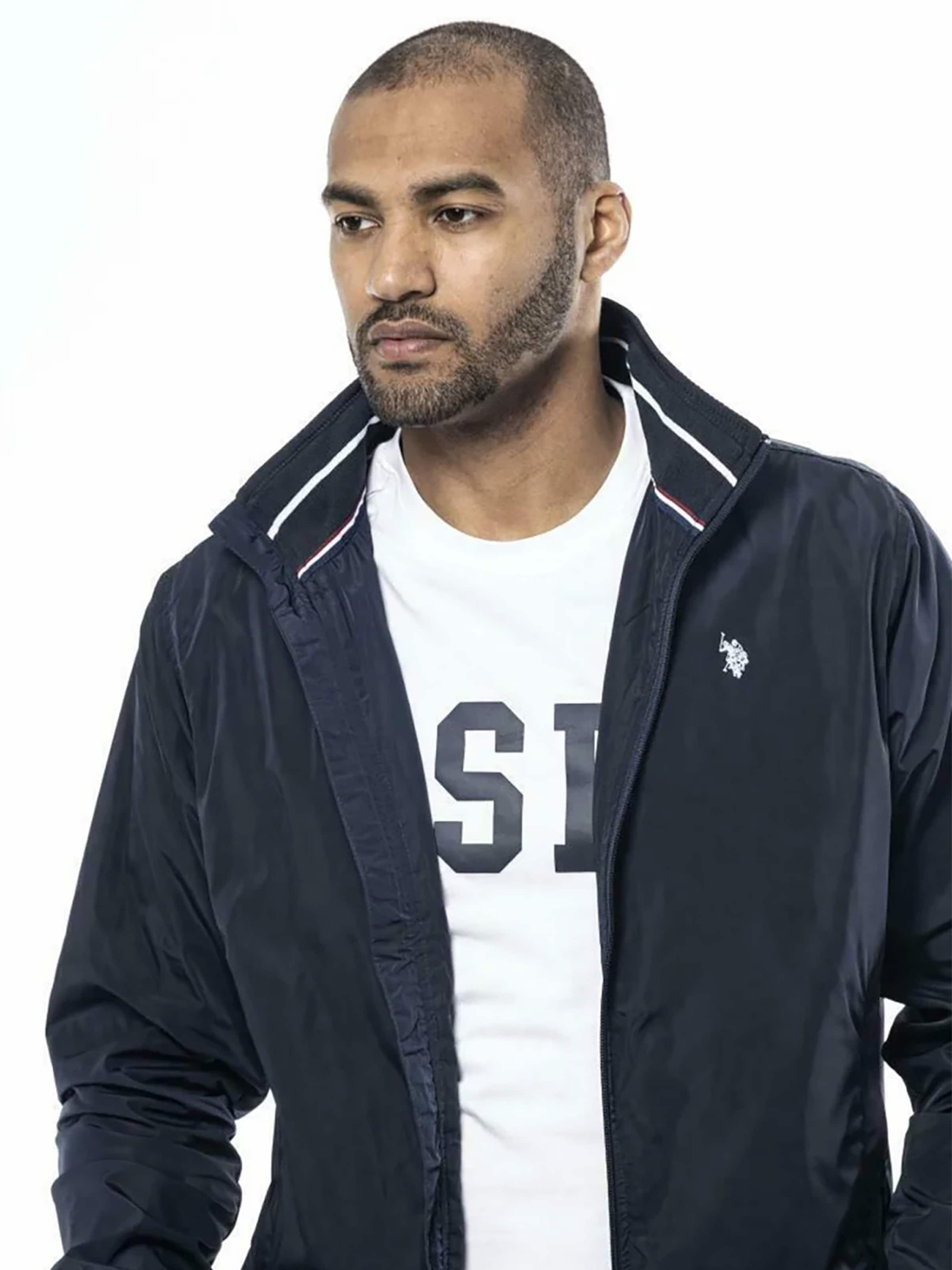 U.S. POLO ASSN. Přechodná bunda 'UMCOLE' – modrá