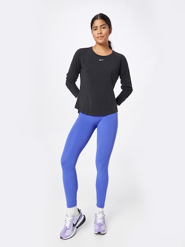 NIKE Funktionsbluse 'One Luxe' i sort