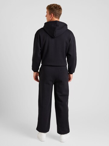 Han Kjøbenhavn Tapered Trousers 'Daily' in Black