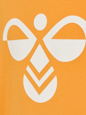 Hummel Urheilullinen collegepaita 'Cuatro' värissä oranssi