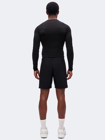 Champion - regular Pantalón deportivo en negro