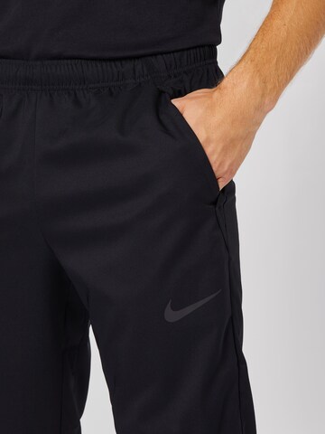 NIKE Regular Workout Pants 'Dry Woven' in Black