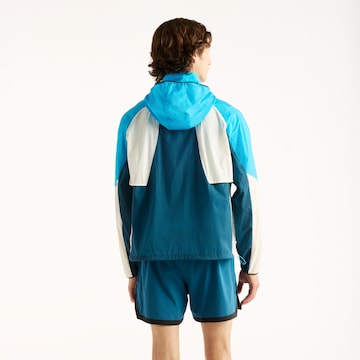 new balance - Chaqueta deportiva en azul