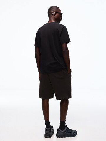 Bershka Trenirka za tek | črna barva