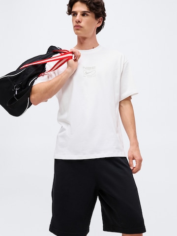NIKE Loosefit Παντελόνι φόρμας 'NAC FLC' σε μαύρο
