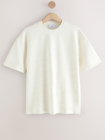 Tricou de la Next pe bej