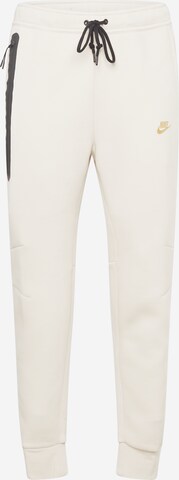 Effilé Pantalon 'TCH FLEECE' Nike Sportswear en beige : devant