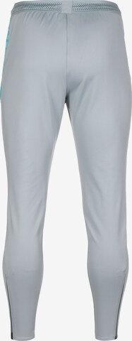 Slimfit Pantaloni sportivi 'Strike' di NIKE in grigio